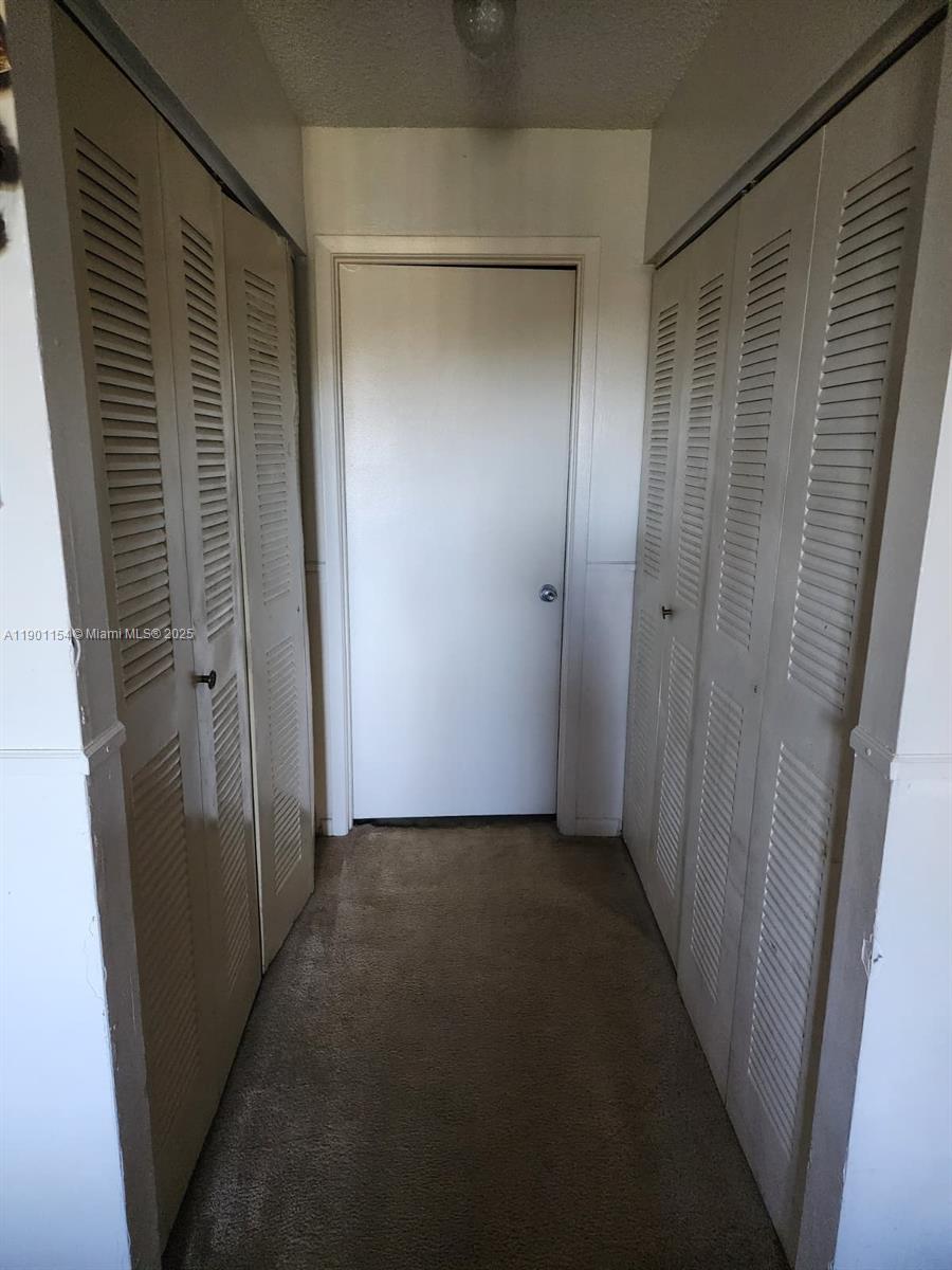 2221 Sherman Circle South, Unit 304 Miramar, FL 33025 - Photo 8 of 10 a view of hallway with closet