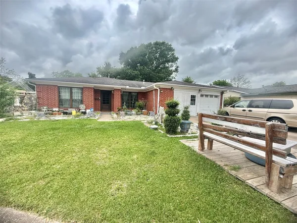 a front view of house with yard and seating area