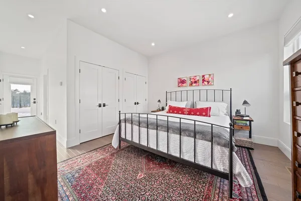 a bedroom with furniture and a window