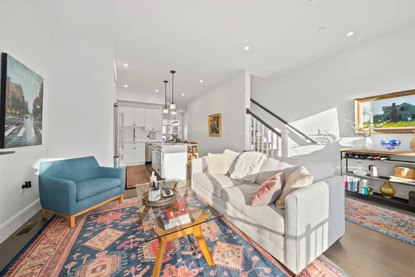 a living room with furniture and a rug