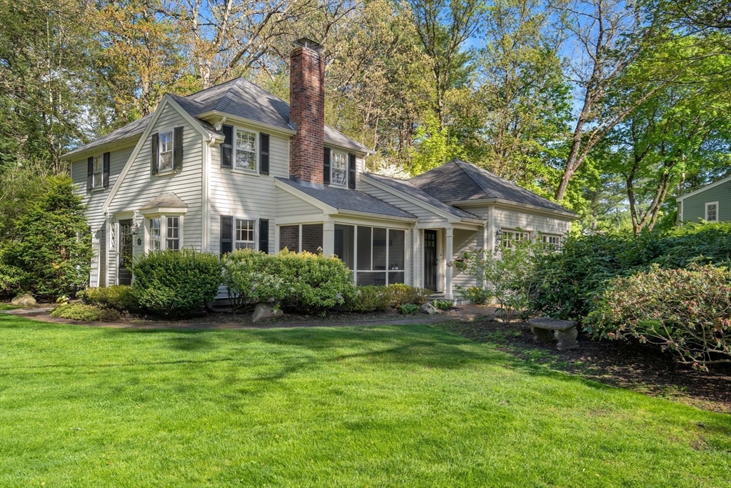 92 Parker Road Wellesley, MA 02482 - Photo 1 of 39 a view of a house next to a big yard and large trees