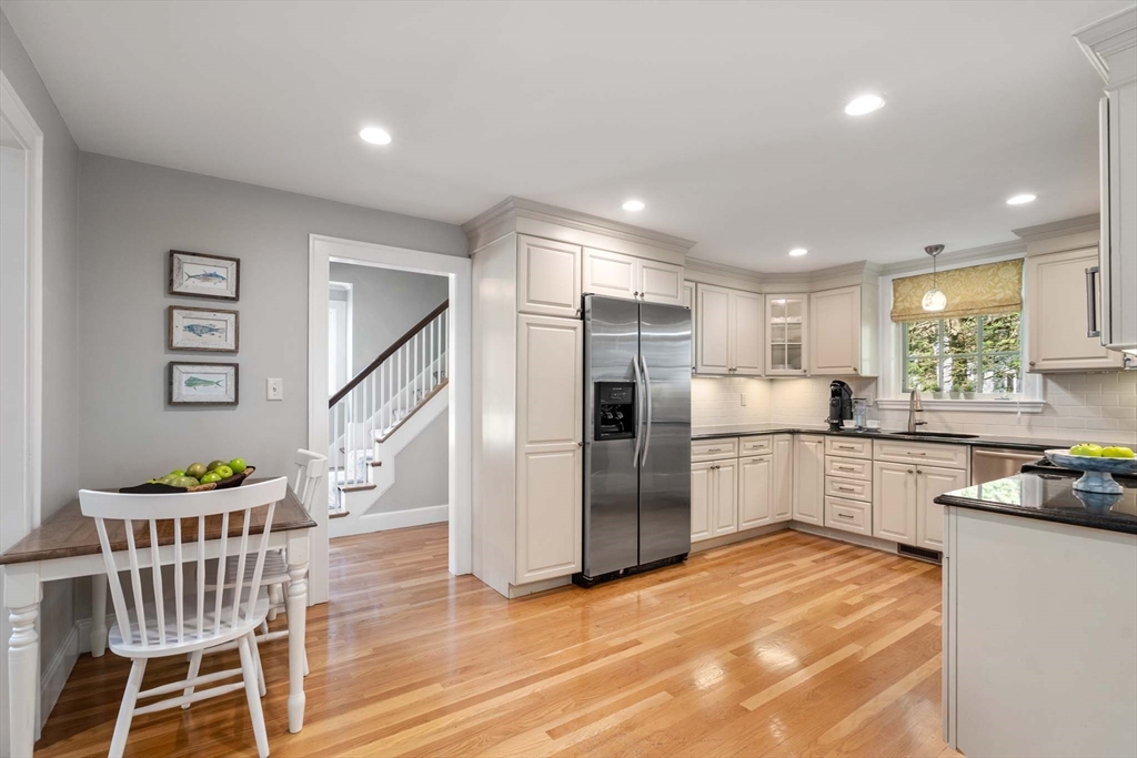 92 Parker Road Wellesley, MA 02482 - Photo 14 of 39 a kitchen with stainless steel appliances kitchen island granite countertop a refrigerator and a stove top oven