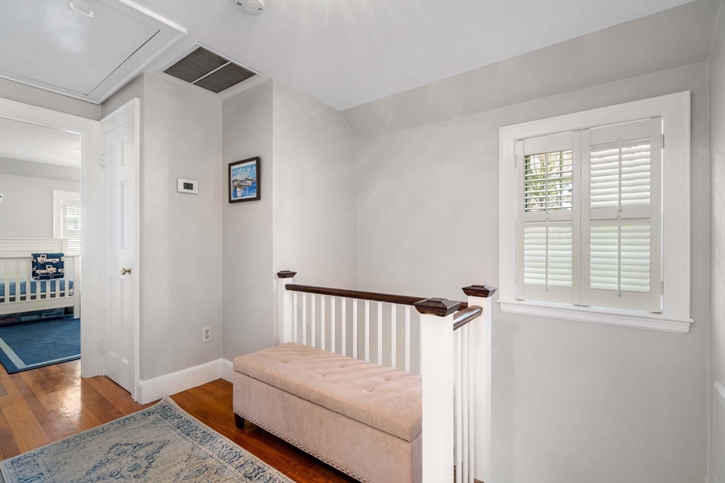 92 Parker Road Wellesley, MA 02482 - Photo 22 of 39 a bedroom with a bed and wooden floor