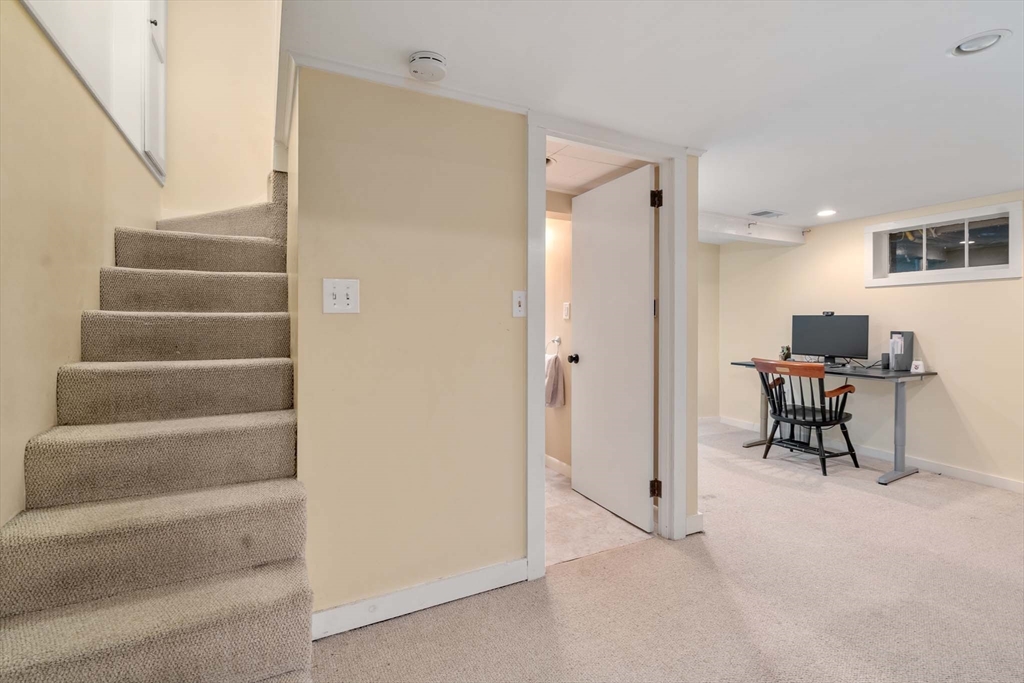 92 Parker Road Wellesley, MA 02482 - Photo 30 of 39 a view of an empty room with stairs and a hallway