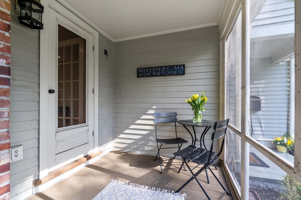 92 Parker Road Wellesley, MA 02482 - Photo 31 of 39 a view of a balcony with table and chairs