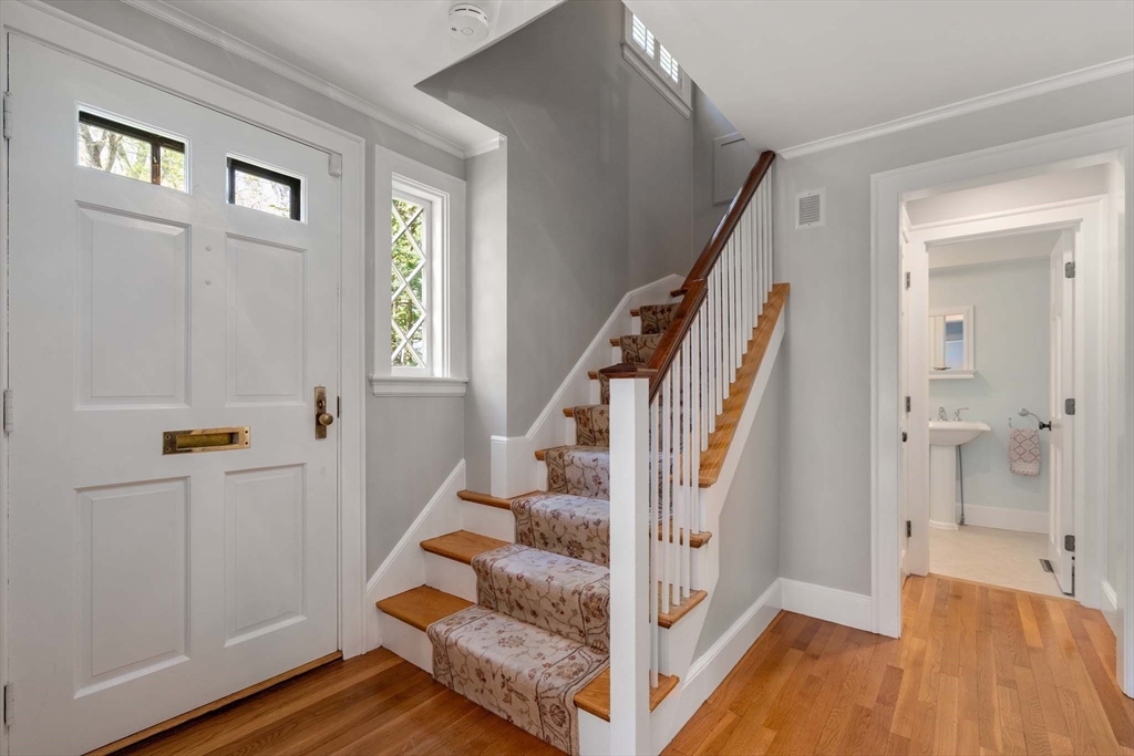 92 Parker Road Wellesley, MA 02482 - Photo 4 of 39 a view of entryway with wooden floor and stairs