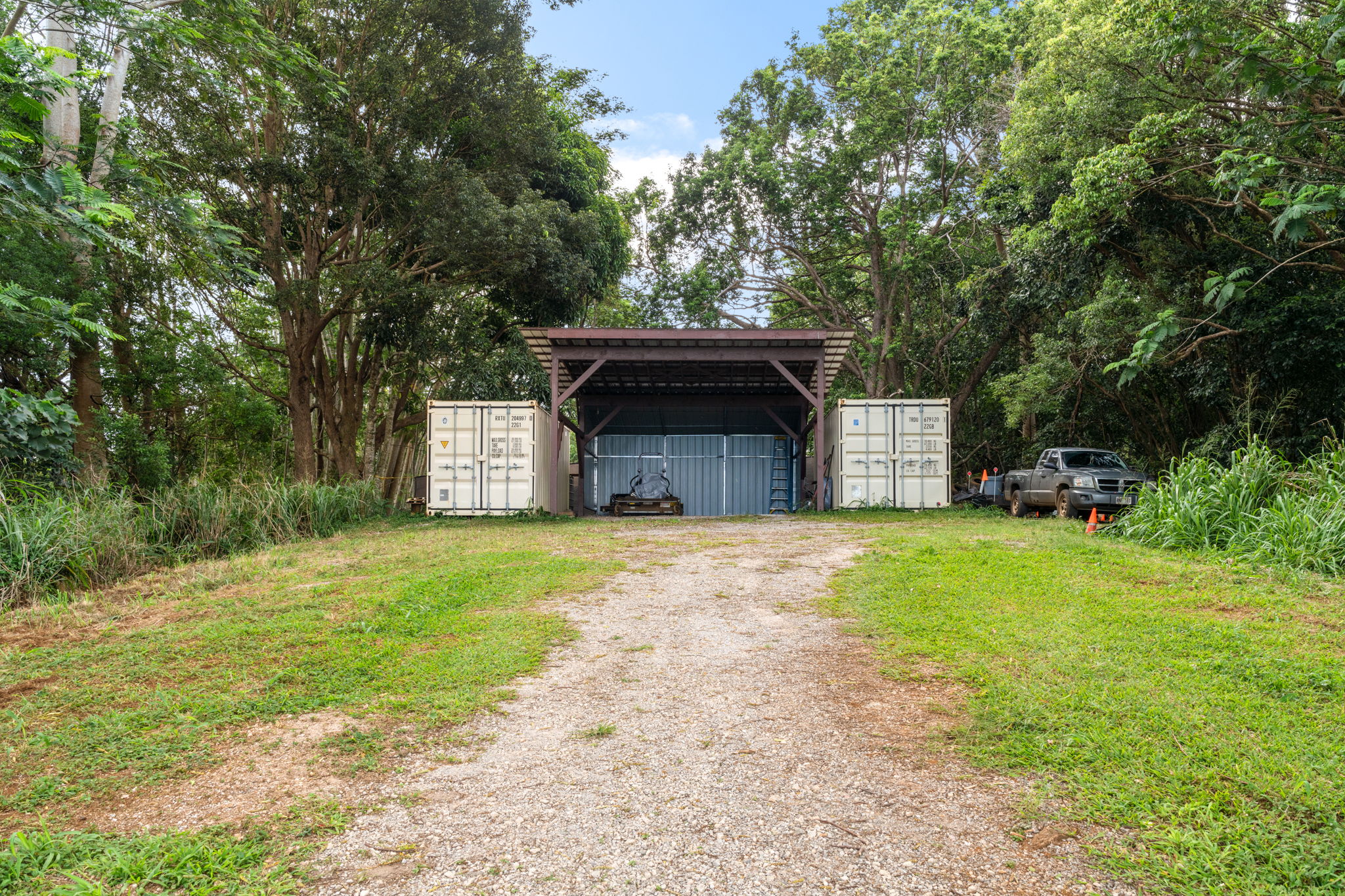 83 B Hauiki Road Kapaa, HI 96746 - Photo 8 of 30 a front view of a house with a yard and garage