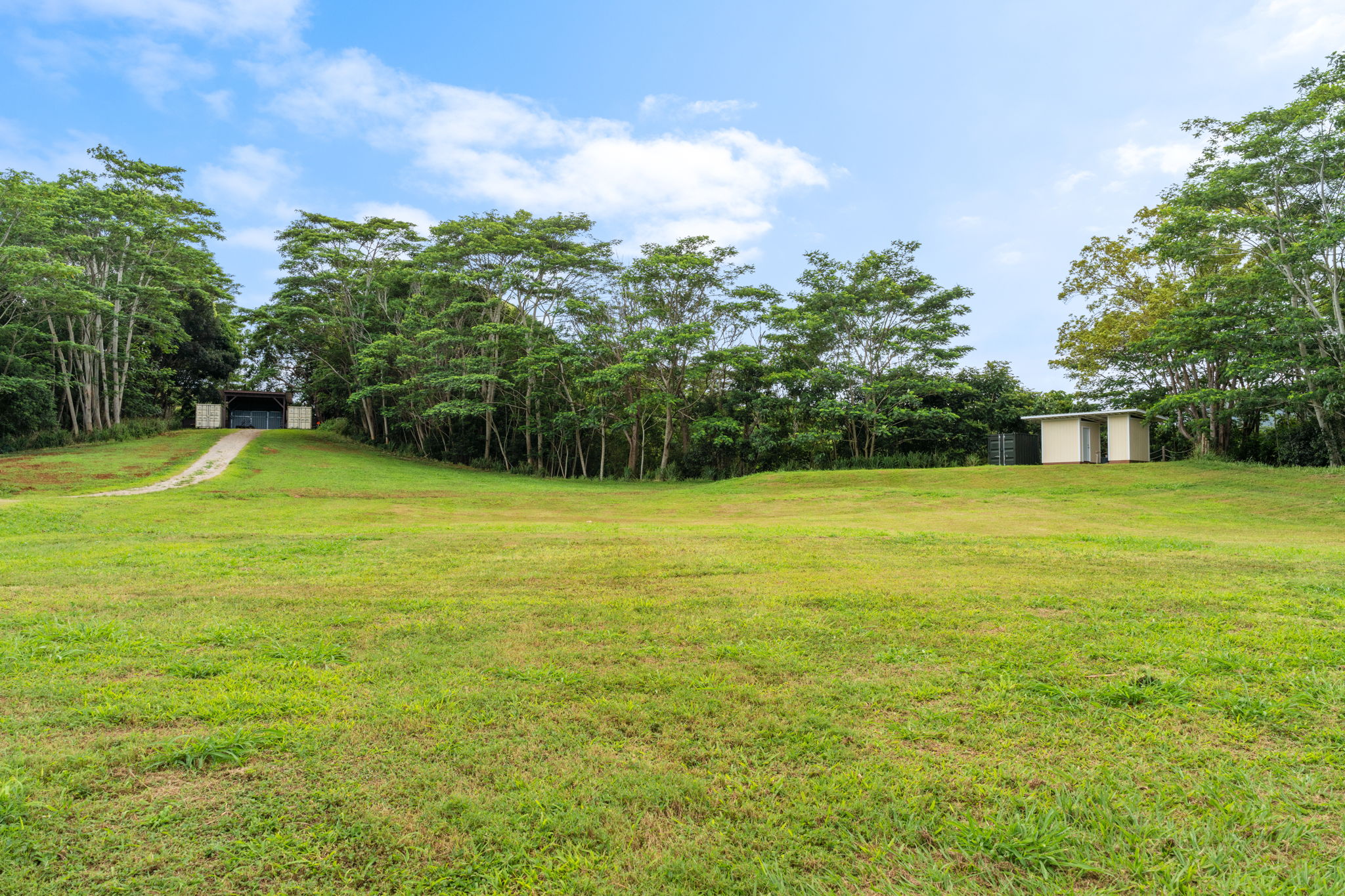 83 B Hauiki Road Kapaa, HI 96746 - Photo 10 of 30 a view of a swimming pool with an outdoor space and seating area