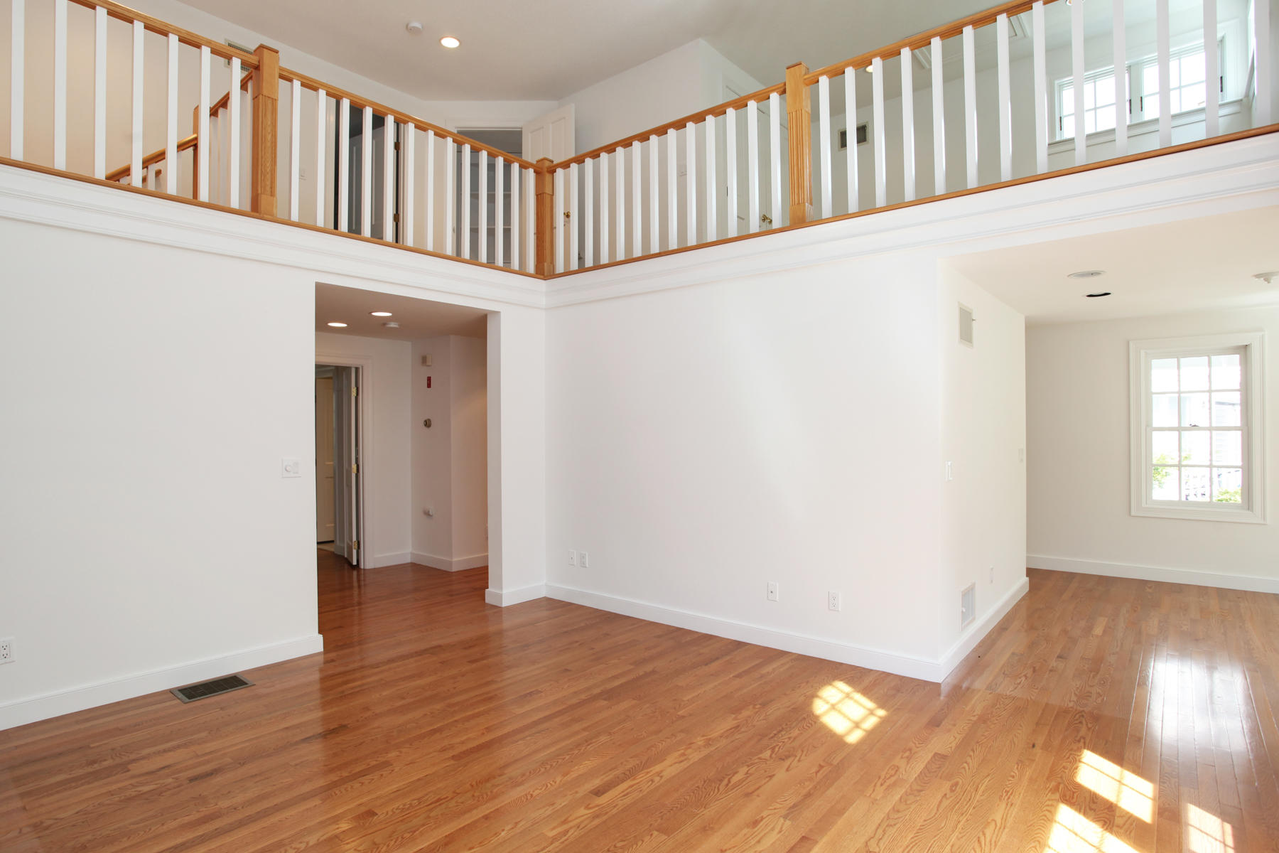 15 Hampton Court, Unit 15 Mashpee, MA 02649 - Photo 11 of 33 a view of an entryway wooden floor and window