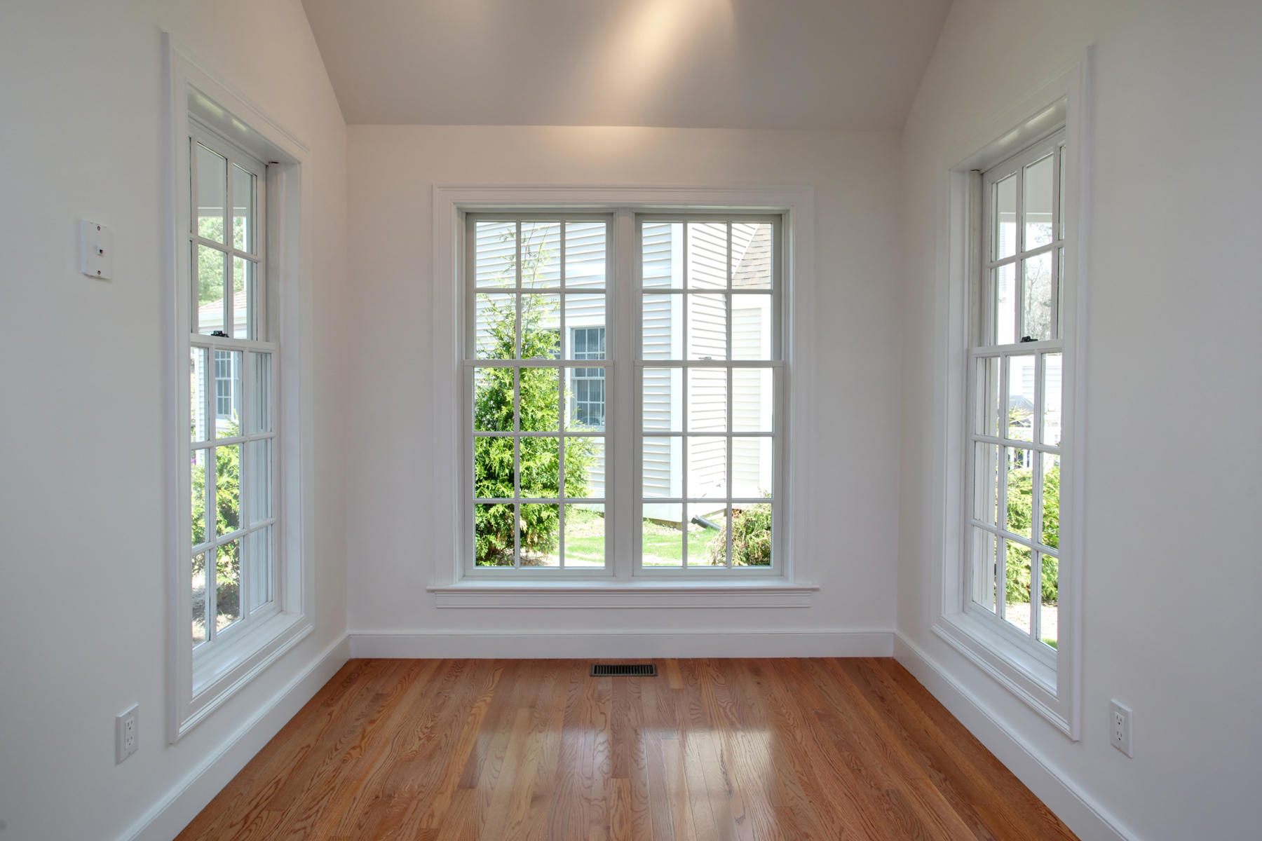 15 Hampton Court, Unit 15 Mashpee, MA 02649 - Photo 15 of 33 an empty room with wooden floor and windows
