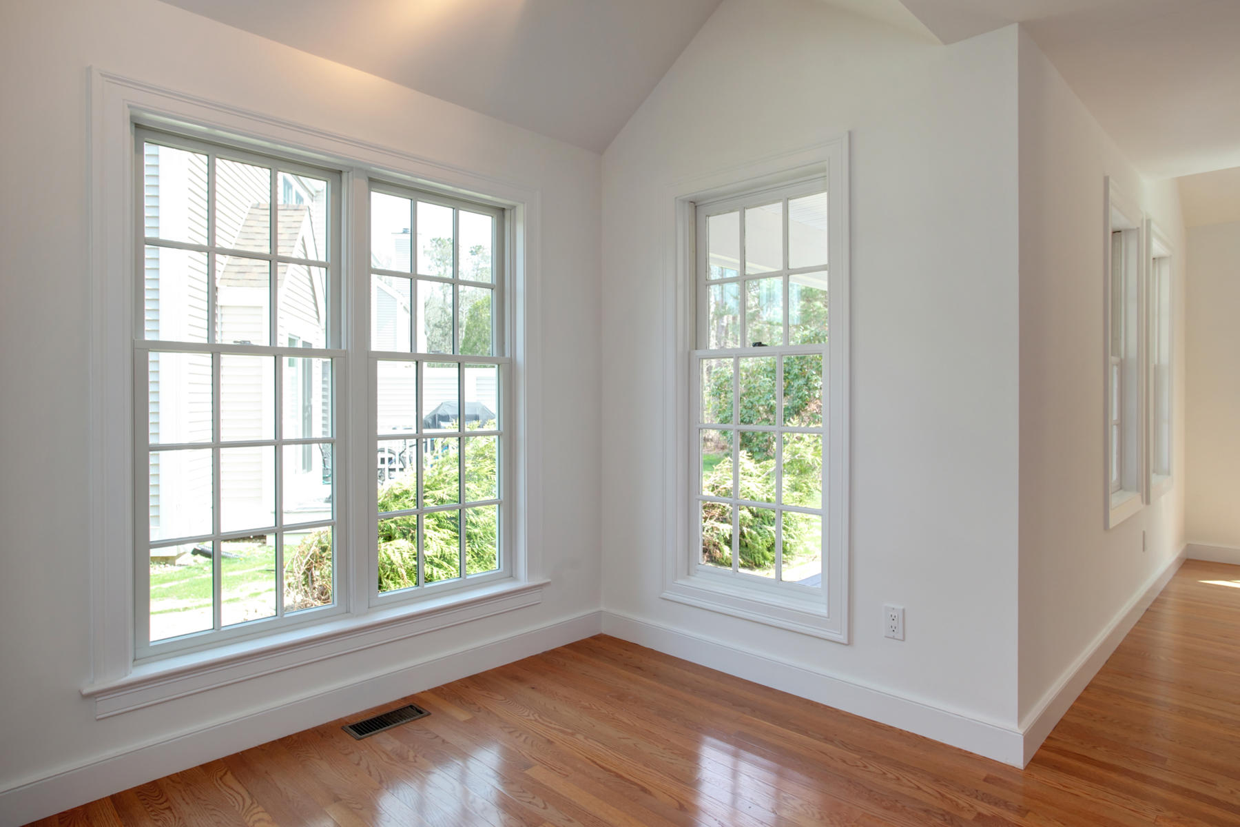 15 Hampton Court, Unit 15 Mashpee, MA 02649 - Photo 16 of 33 a view of an empty room with wooden floor and a window