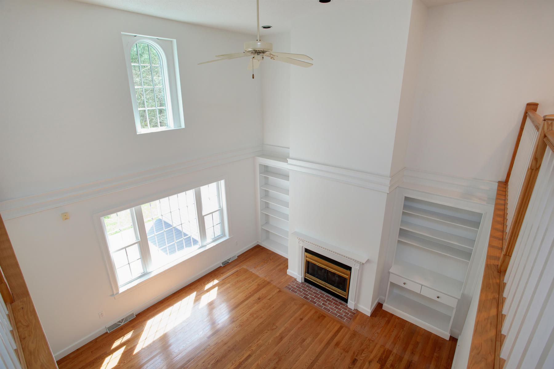 15 Hampton Court, Unit 15 Mashpee, MA 02649 - Photo 22 of 33 a view of an empty room with wooden floor and a window