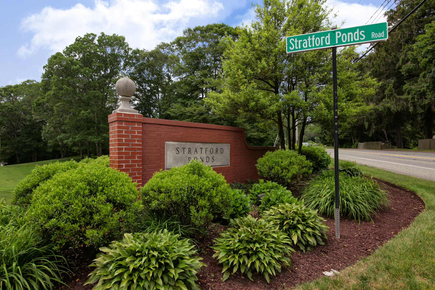 15 Hampton Court, Unit 15 Mashpee, MA 02649 - Photo 26 of 33 a view of a sign in a garden