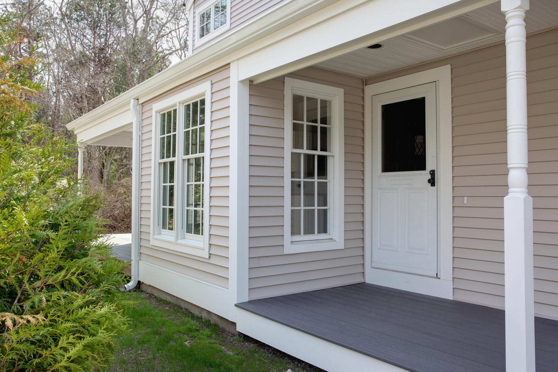 15 Hampton Court, Unit 15 Mashpee, MA 02649 - Photo 5 of 33 a view of a house with a large window and wooden fence