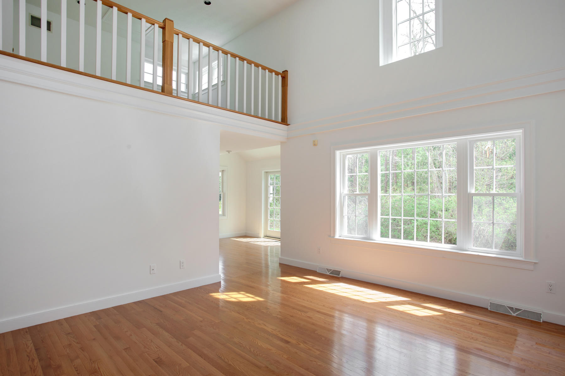 15 Hampton Court, Unit 15 Mashpee, MA 02649 - Photo 10 of 33 a view of an empty room with wooden floor and a window