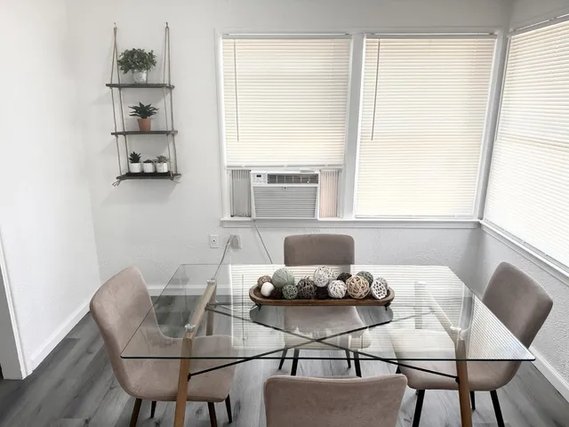 a view of a dining room with furniture window and outside view