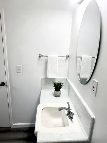 a bathroom with a sink and a mirror