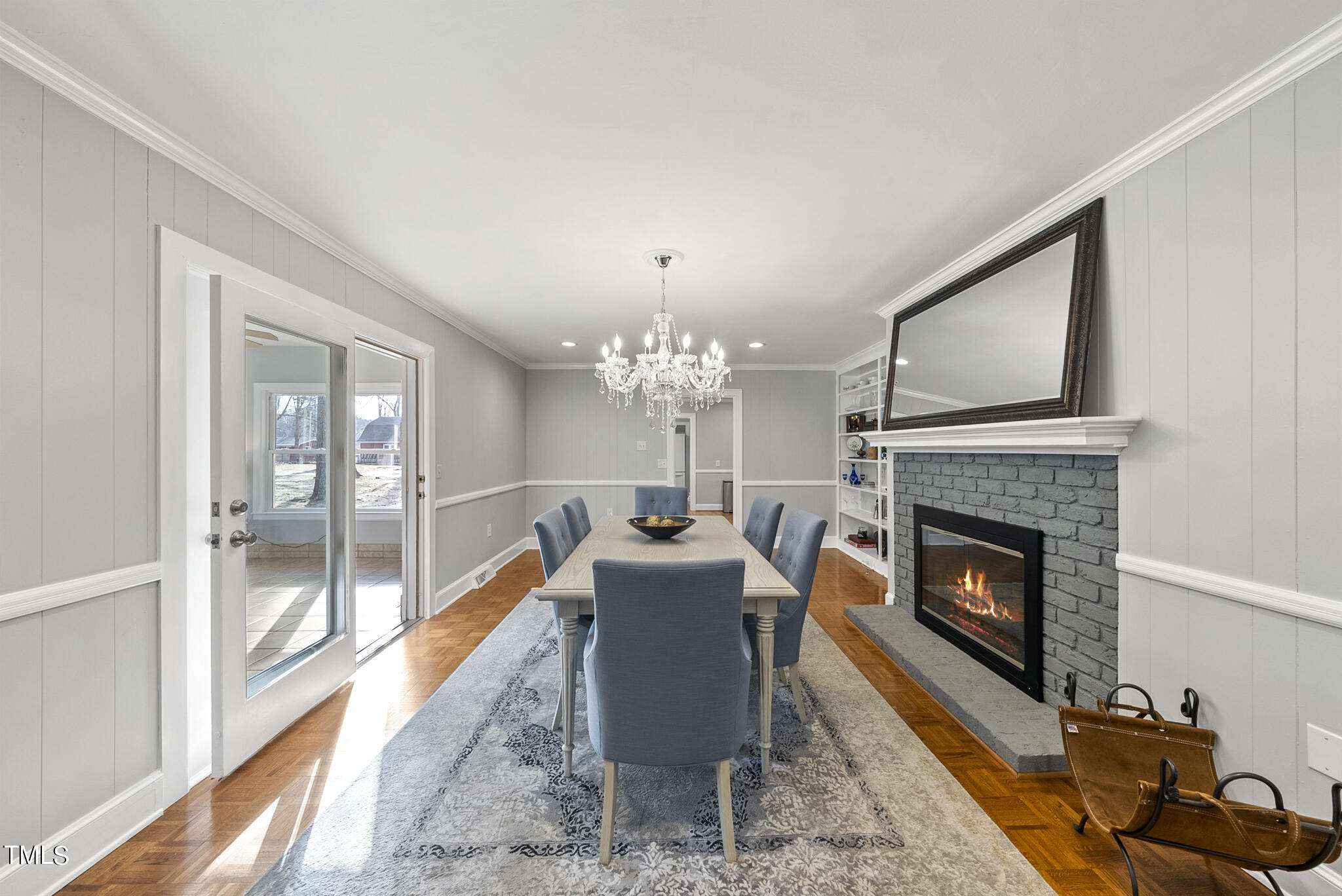 410 Goodwin Road Durham, NC 27712 - Photo 14 of 31 a living room with furniture a chandelier and a fireplace
