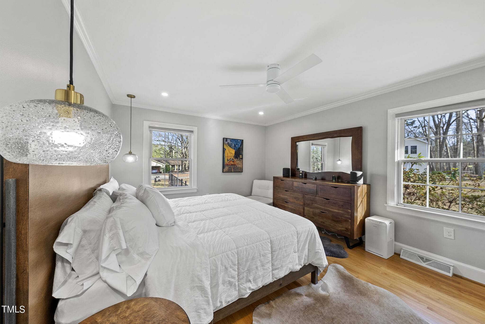 410 Goodwin Road Durham, NC 27712 - Photo 17 of 31 a spacious bedroom with a bed and glass windows