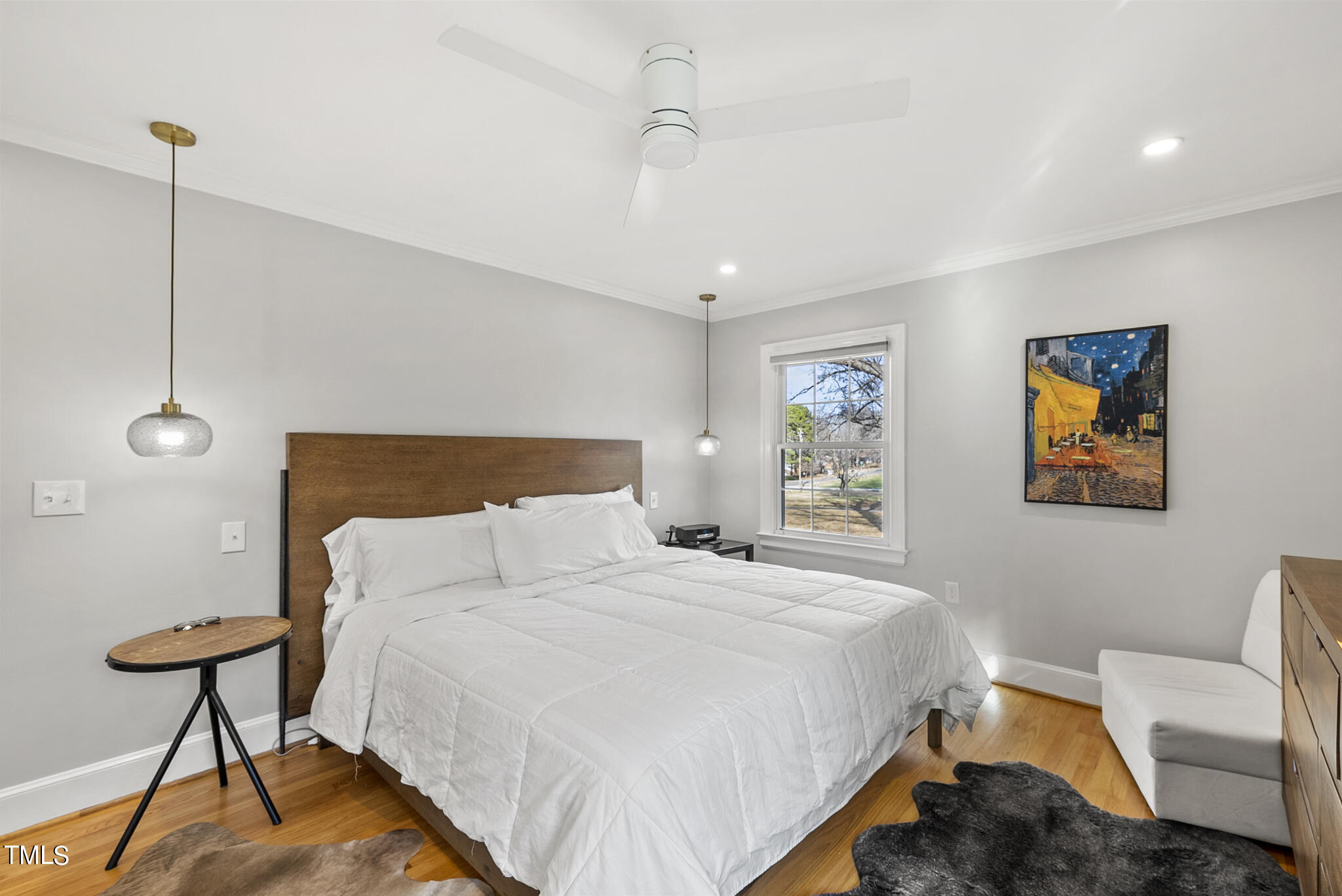 410 Goodwin Road Durham, NC 27712 - Photo 18 of 31 a bedroom with a bed and a chandelier