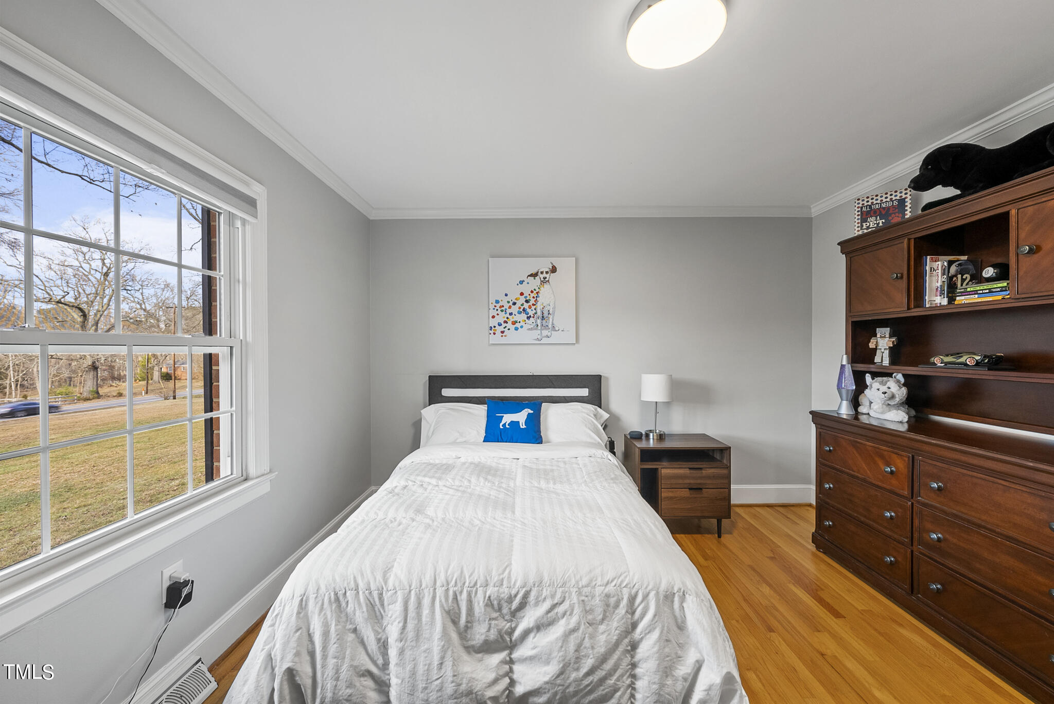 410 Goodwin Road Durham, NC 27712 - Photo 21 of 31 a bedroom with a bed and a window