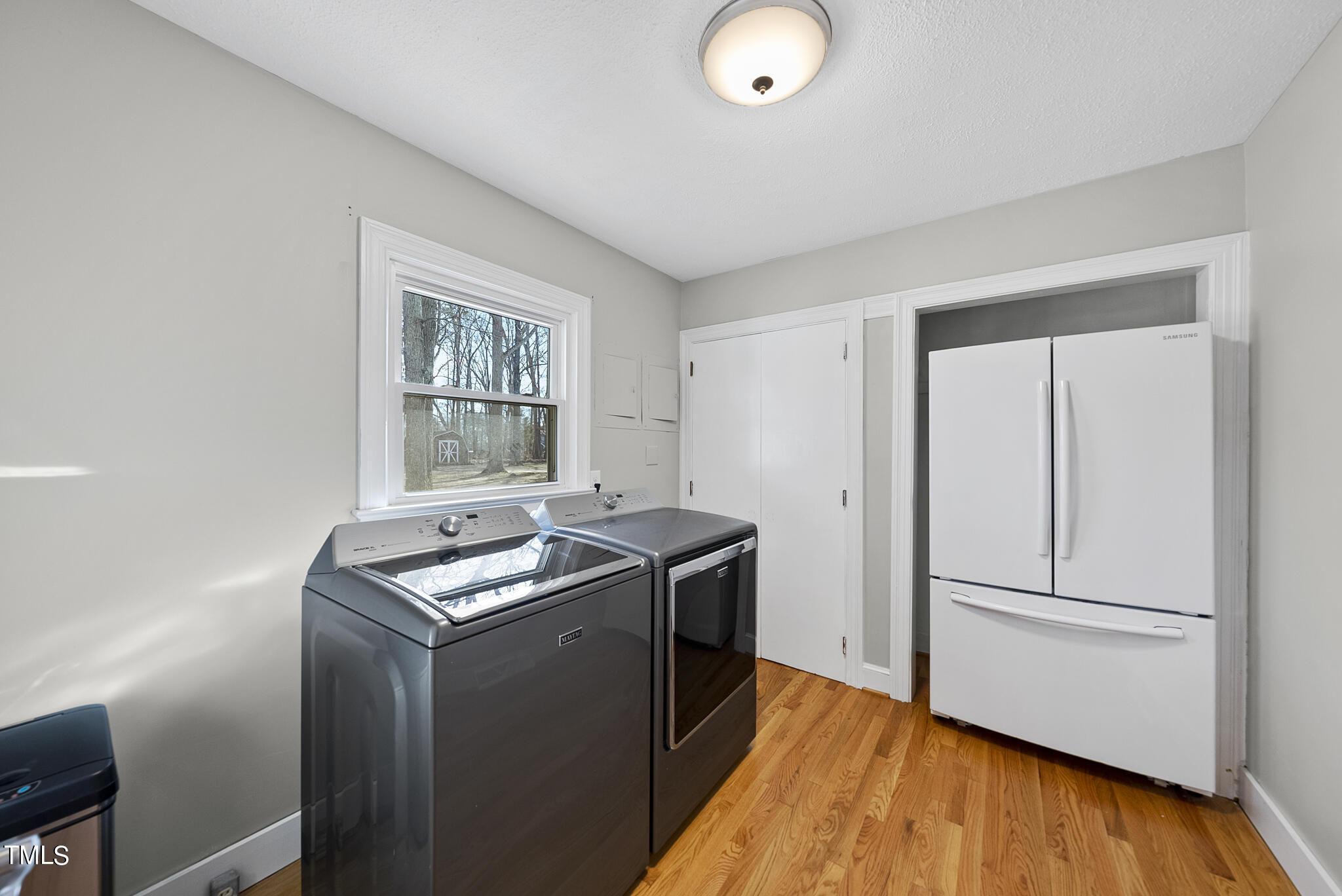 410 Goodwin Road Durham, NC 27712 - Photo 25 of 31 a utility room with wooden floor washer and dryer