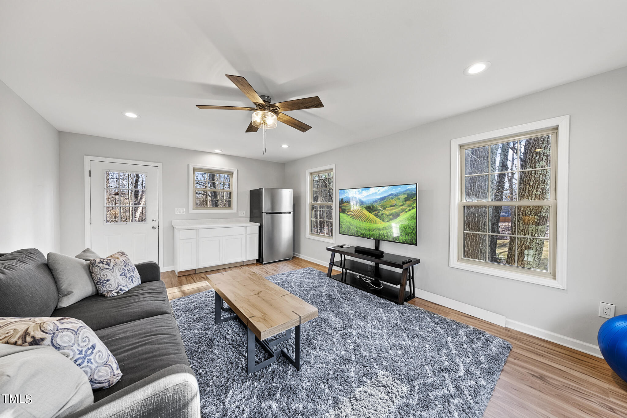 410 Goodwin Road Durham, NC 27712 - Photo 30 of 31 a living room with furniture and a flat screen tv