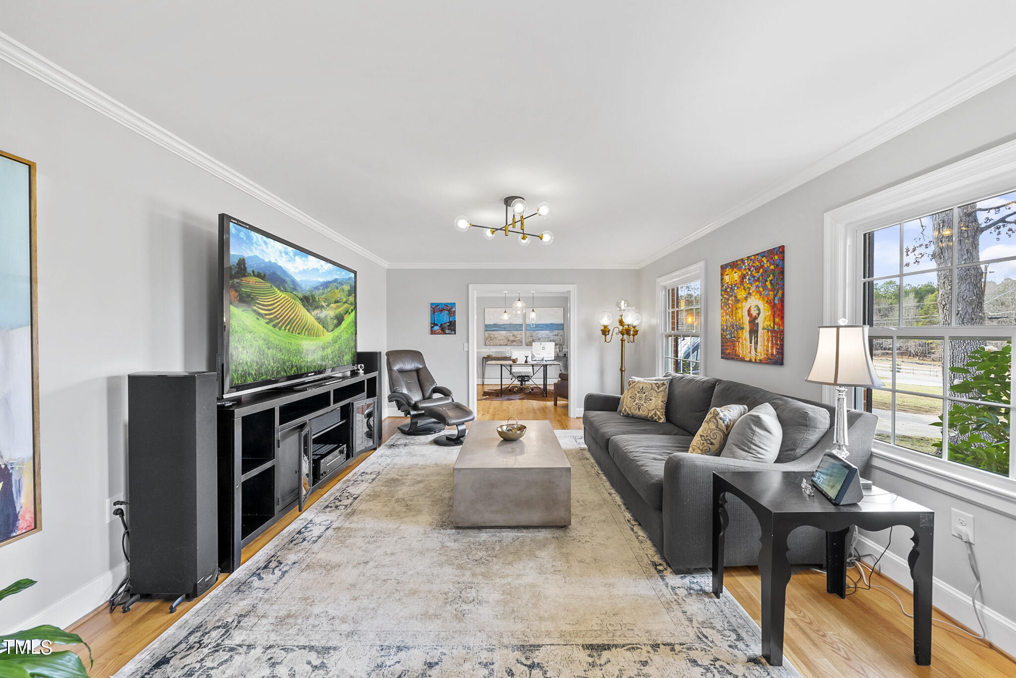 410 Goodwin Road Durham, NC 27712 - Photo 5 of 31 a living room with furniture and a flat screen tv