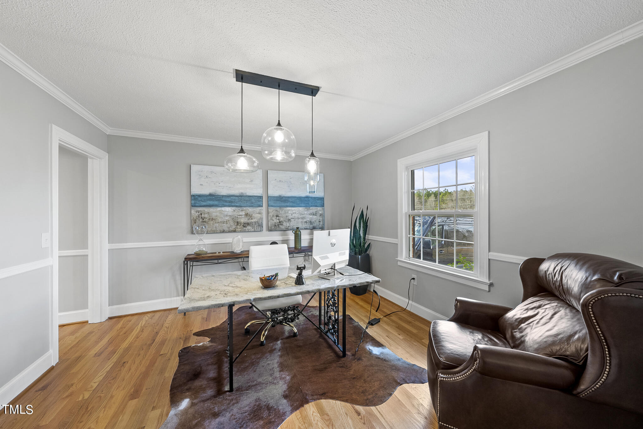 410 Goodwin Road Durham, NC 27712 - Photo 7 of 31 a living room with furniture and a chandelier