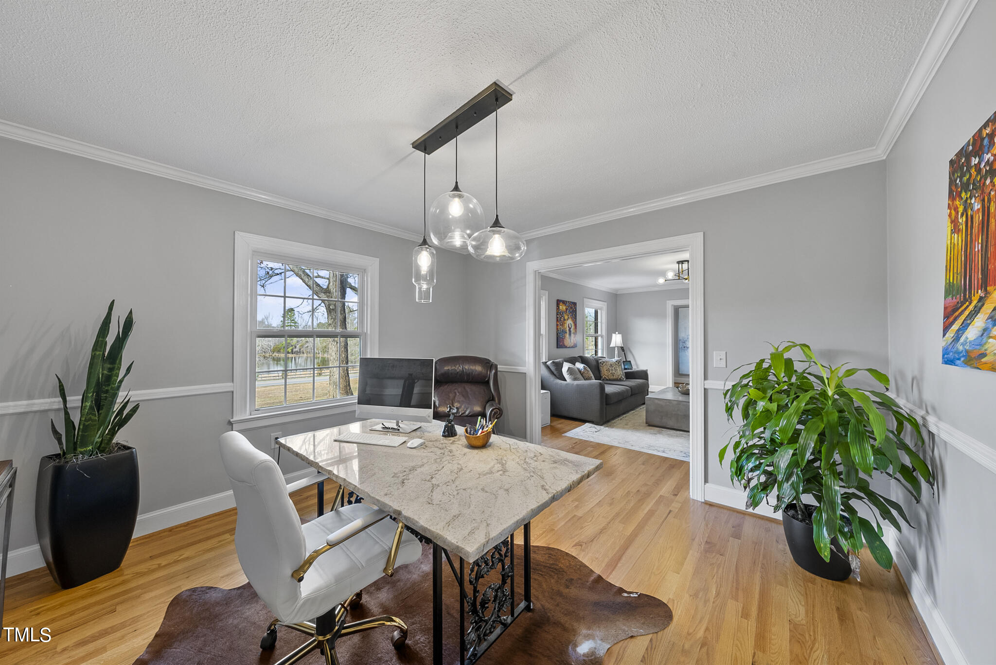 410 Goodwin Road Durham, NC 27712 - Photo 8 of 31 a view of a dining room with furniture window and wooden floor