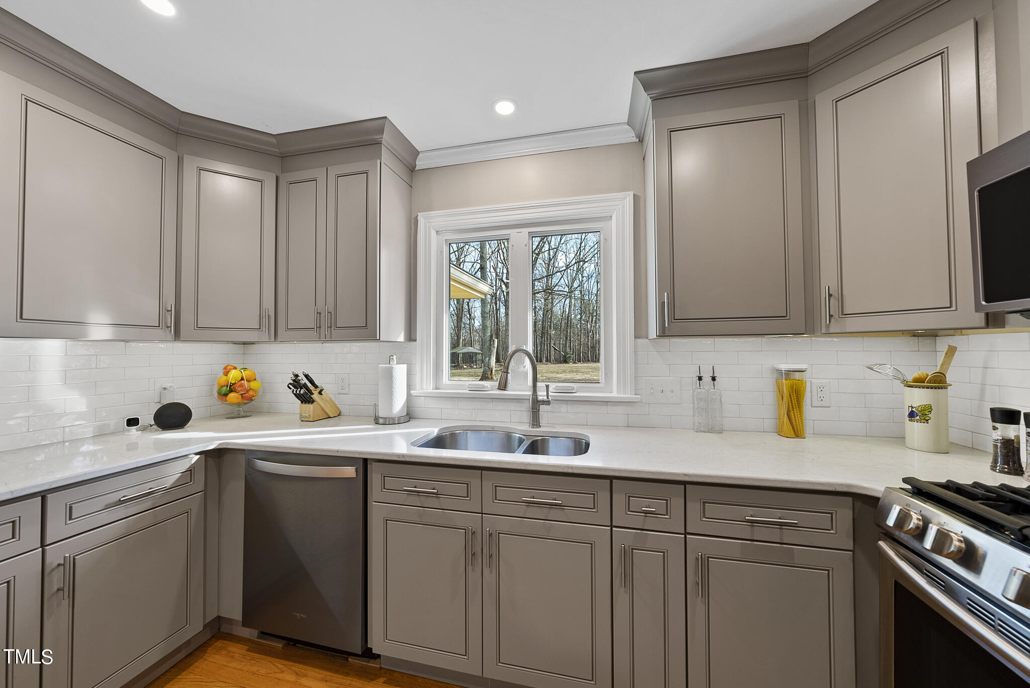 410 Goodwin Road Durham, NC 27712 - Photo 9 of 31 a kitchen with a sink cabinets and window