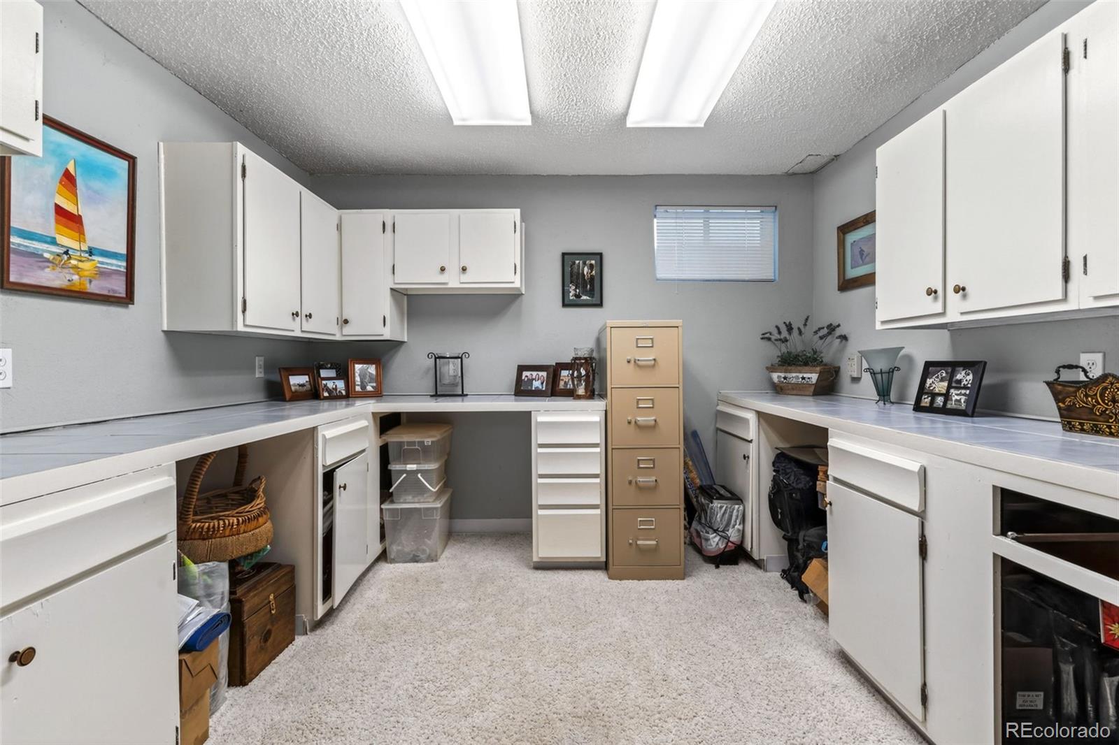 12360 South Mesa View Road Larkspur, CO 80118 - Photo 17 of 50 a kitchen with cabinets appliances and a window