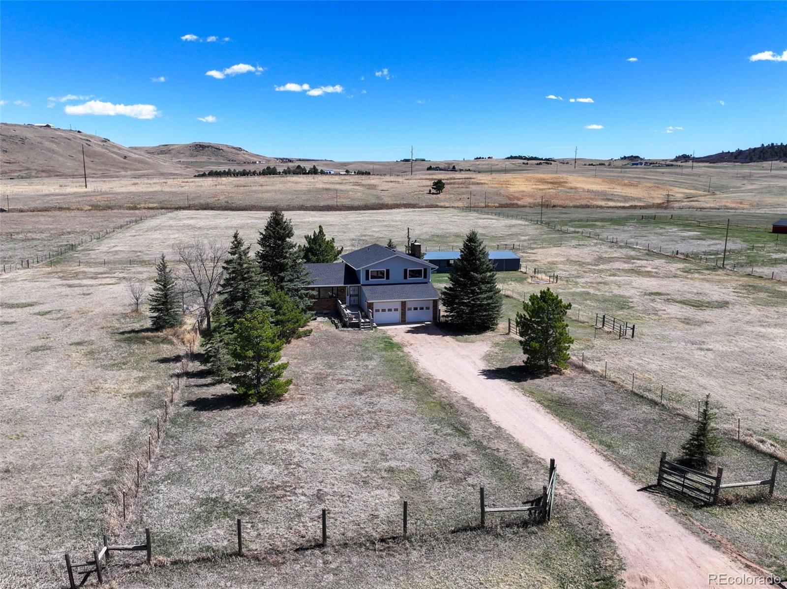 12360 South Mesa View Road Larkspur, CO 80118 - Photo 27 of 50 a view of a lake with a mountain