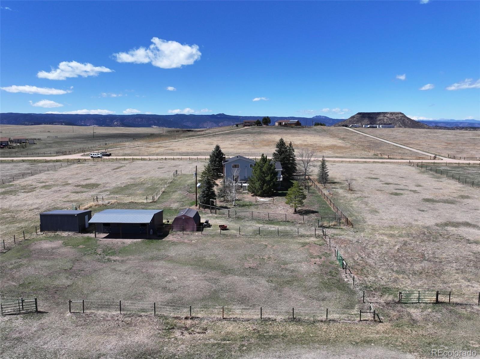 12360 South Mesa View Road Larkspur, CO 80118 - Photo 31 of 50 a view of a lake with a beach