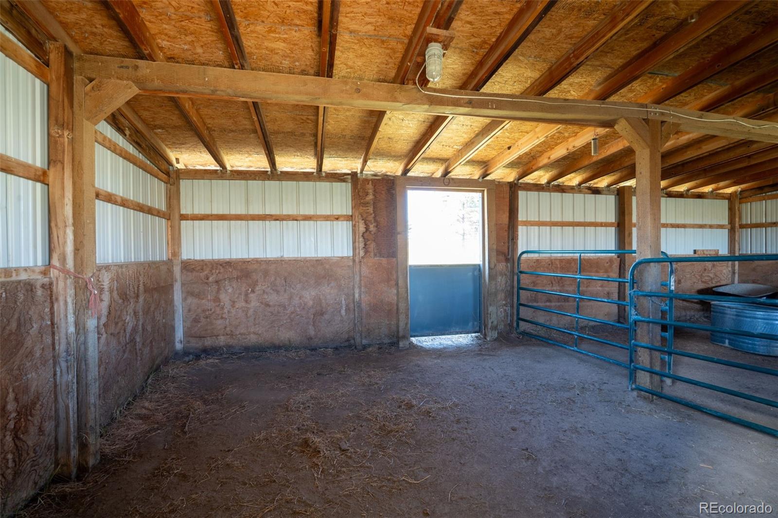 12360 South Mesa View Road Larkspur, CO 80118 - Photo 41 of 50 a view of an empty room with windows
