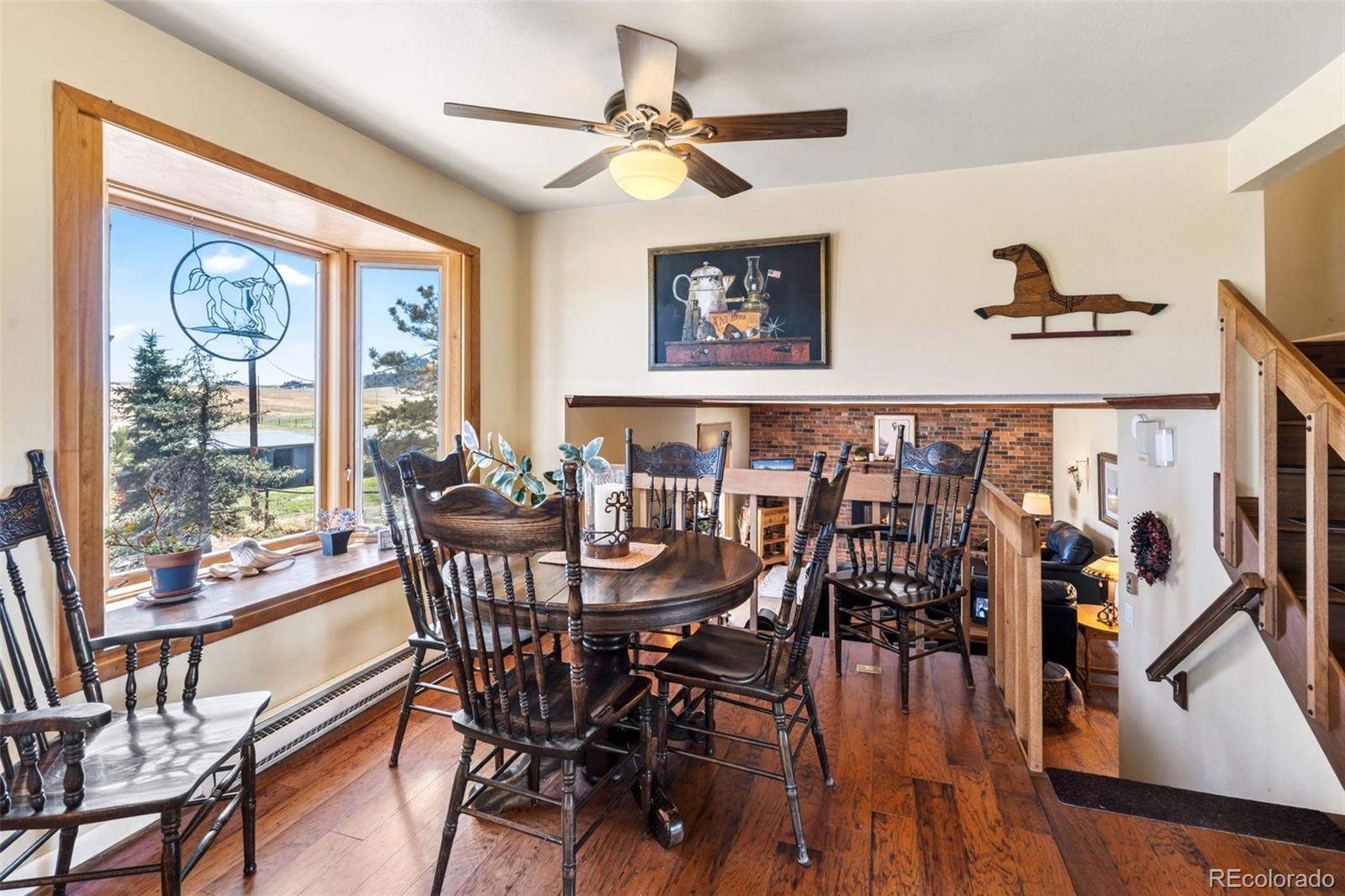 12360 South Mesa View Road Larkspur, CO 80118 - Photo 6 of 50 a view of a dining room with furniture window and outside view