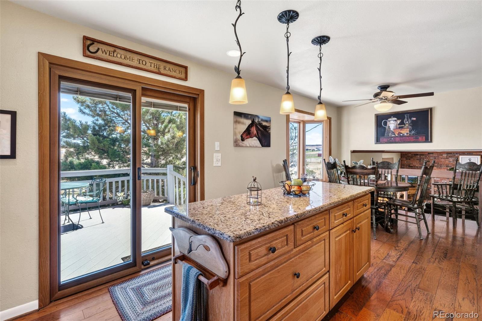 12360 South Mesa View Road Larkspur, CO 80118 - Photo 7 of 50 a view of a kitchen counter top space with furniture