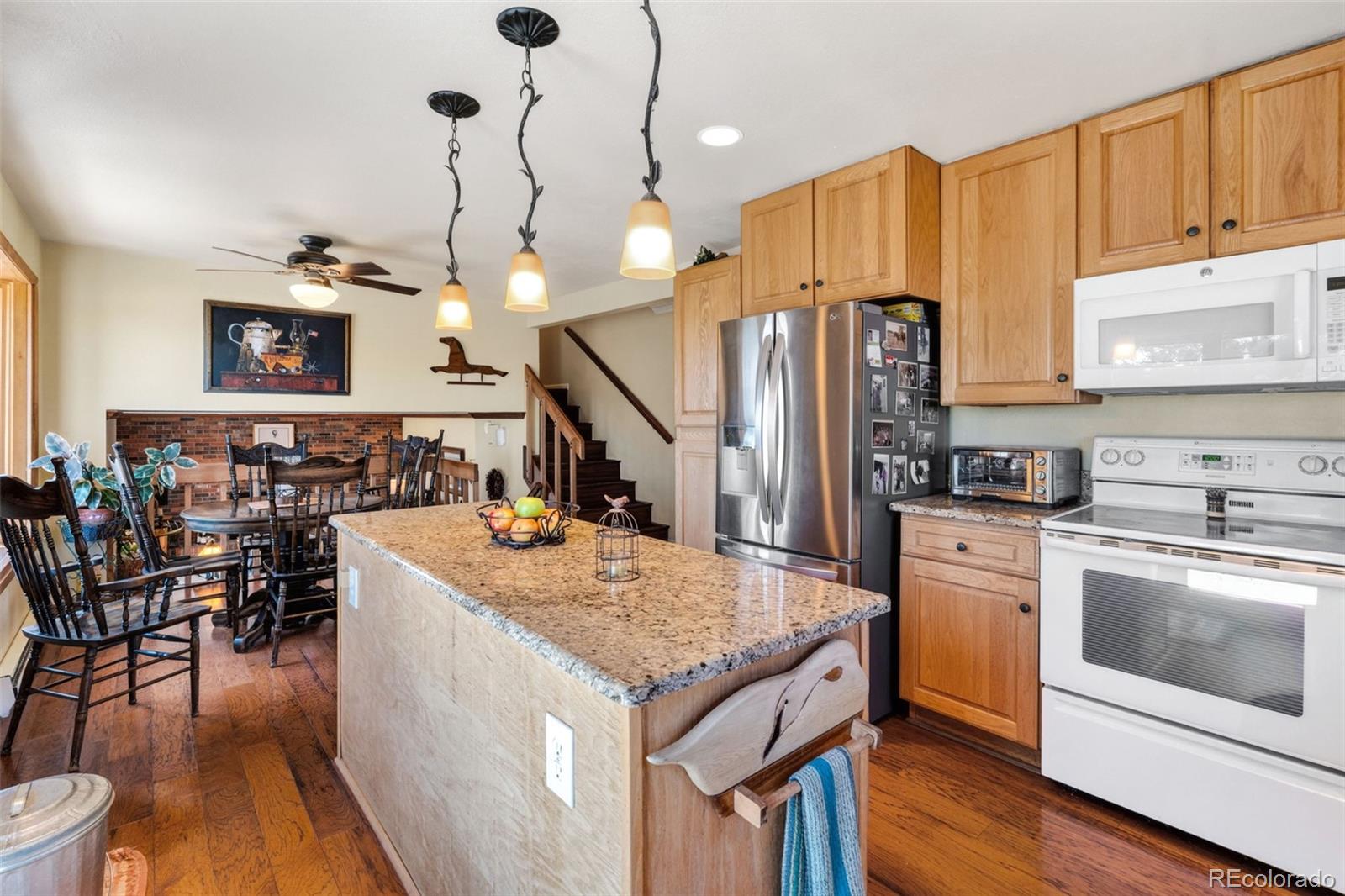 12360 South Mesa View Road Larkspur, CO 80118 - Photo 9 of 50 a kitchen with stainless steel appliances granite countertop a stove and refrigerator