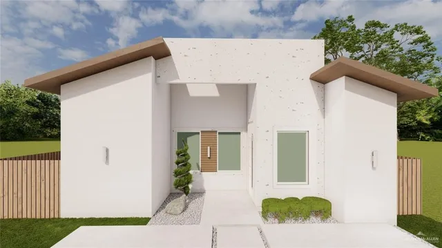 a view of a house with a backyard