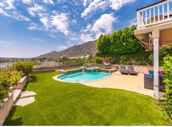 a view of a swimming pool with an outdoor seating