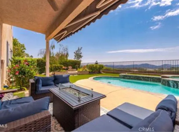 a view of a swimming pool with a patio