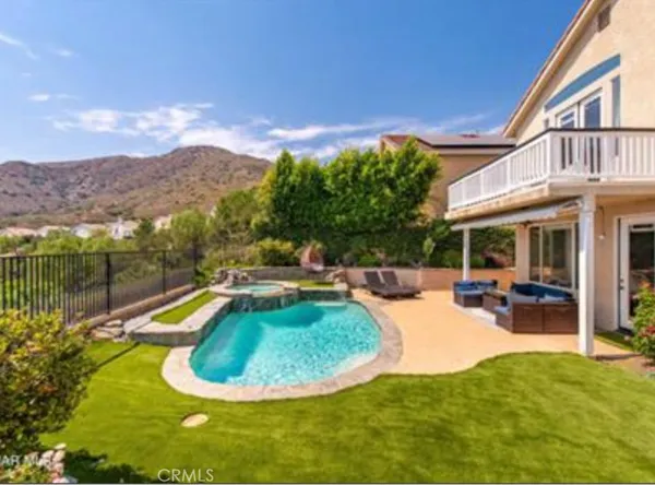 a view of a swimming pool with a patio