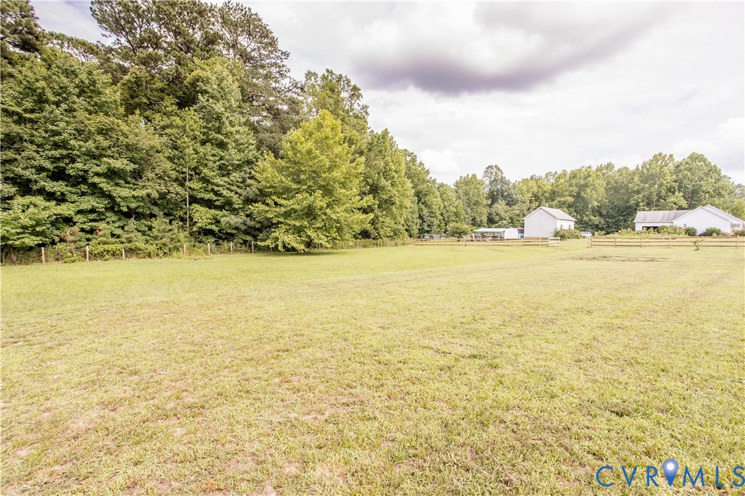 20411 Horseshoe Road Carson, VA 23830 - Photo 11 of 35 Expansive grassy field bordered by mature trees