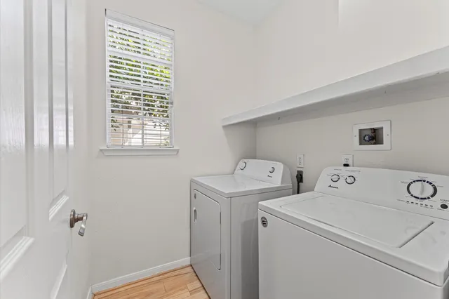 a view of storage room with washer and dryer
