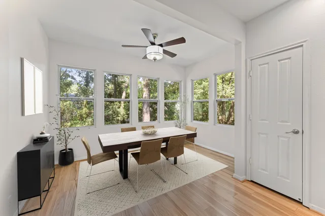 a view of a dining room with furniture window and outside view