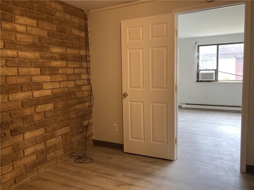 500 Milltown Road, Unit 505A New Kensington, PA 15068 - Photo 12 of 17 a view of an empty room with wooden floor and a window