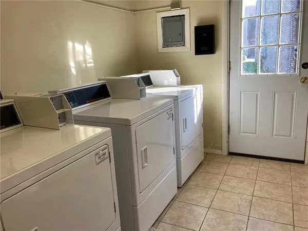 a utility room with dryer and washer