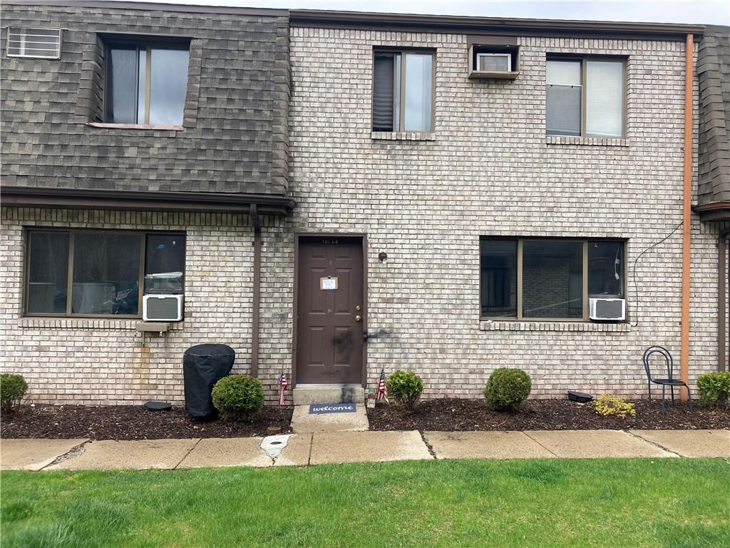 500 Milltown Road, Unit 505A New Kensington, PA 15068 - Photo 2 of 17 a front view of a house with a yard
