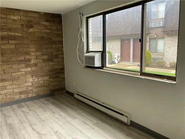 a view of a room that has a bench in it