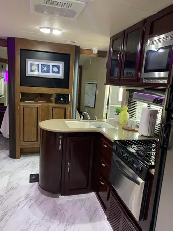 a kitchen with stainless steel appliances granite countertop a stove and a sink